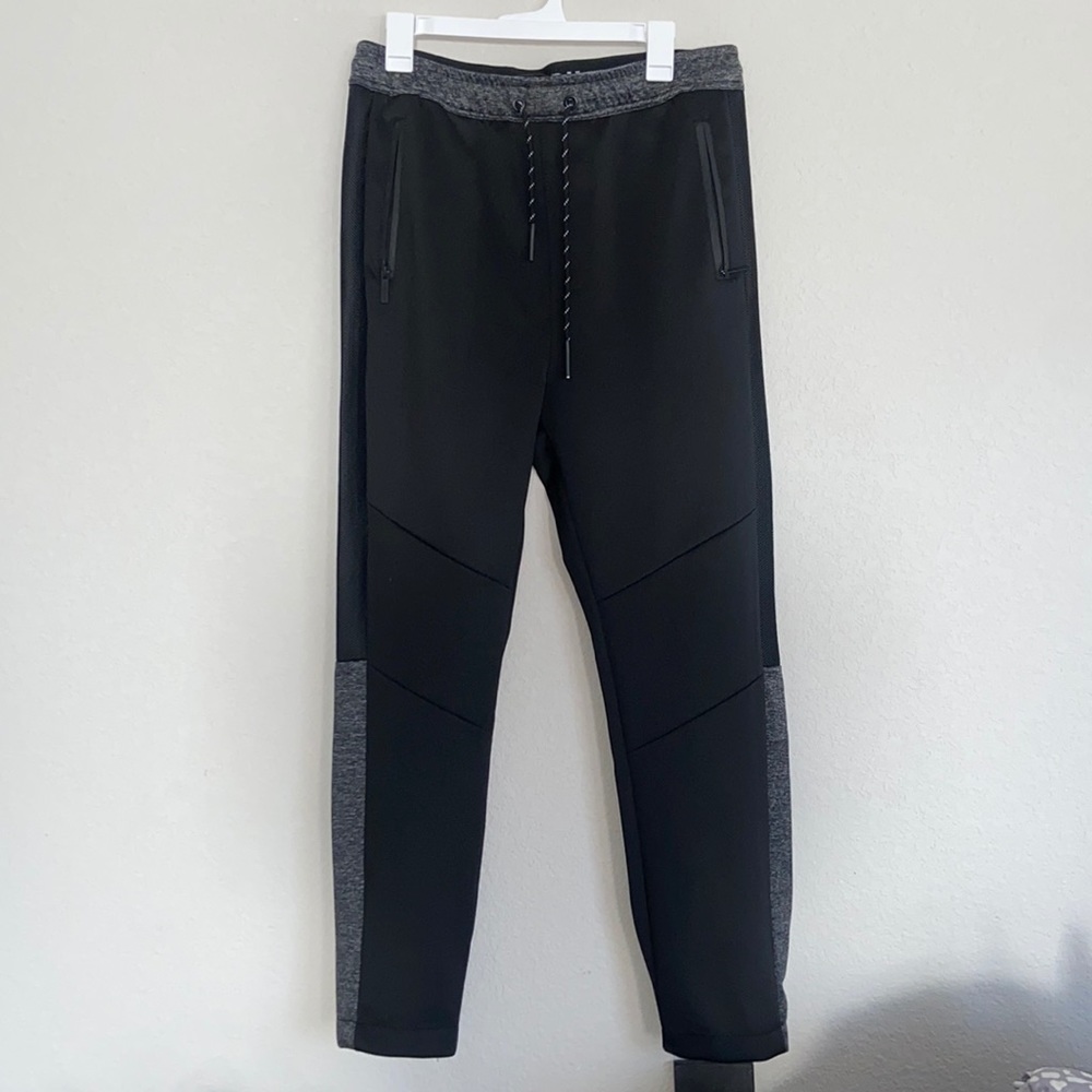 Black pants with gray trimming on legs and top.